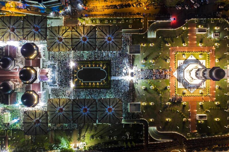 This drone picture taken shows Indonesian Muslims praying in Banda Aceh, in Aceh province, . / AFP