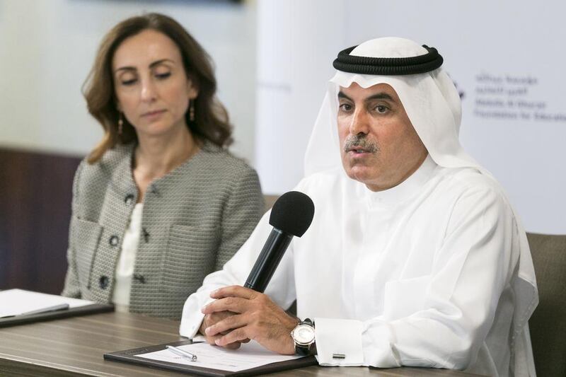 Abdul Aziz Al Ghurair, chairman of the board of trustees of the Abdulla Al Ghurair Foundation for Education, announces the launch of the Open Learning Scholars Programme. Reem Mohammed / The National