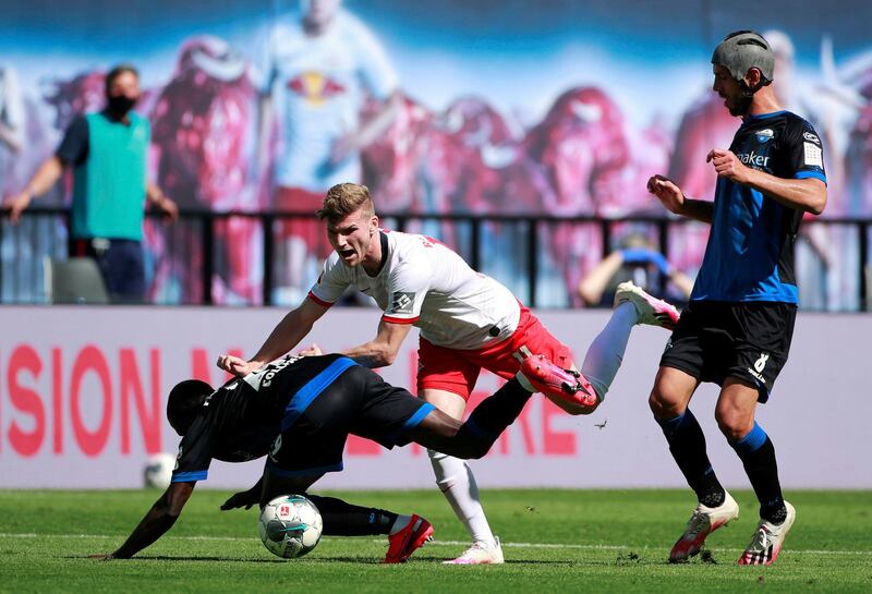 Paderborns Jamilu Collins against RB Leipzigs Timo Werner, right. PA