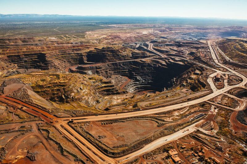 The iron ore excavation pit stands at the Sishen open cast mine, operated by Kumba Iron Ore Ltd., an iron ore-producing unit of Anglo American Plc, in Sishen, South Africa, on Tuesday, May 22, 2018. Kumba Iron Ore may diversify into other minerals such as manganese and coal as Africa’s top miner of the raw material seeks opportunities for growth and to shield its business from price swings. Photographer: Waldo Swiegers/Bloomberg