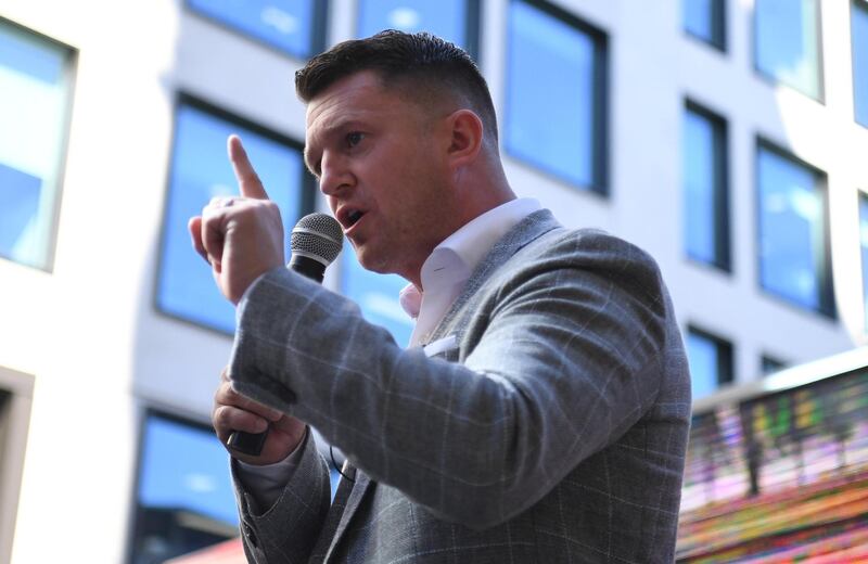epa07693918 Former leader of the far-right English Defence League, Tommy Robinson speaks at a rally as he arrives for a court appearance at the Old Bailey in London, Britain, 04 July 2019. Robinson, whose real name is Stephen Yaxley-Lennon, is facing contempt of court charges for allegedly filming people during a criminal trial and posting the footage on social media.  EPA/NEIL HALL