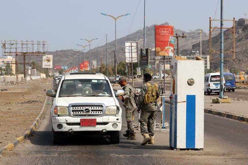 Security Belt Force fighters man a checkpoint in the Khor Maksar district of Yemen's second city of Aden. AFP