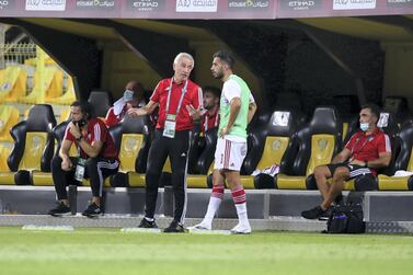 UAE manager Bert van Marwijk speaks to Majed Hassan during the game against Thailand in the World Cup qualifiers at the Zabeel Stadium, Dubai. Chris Whiteoak / The National.