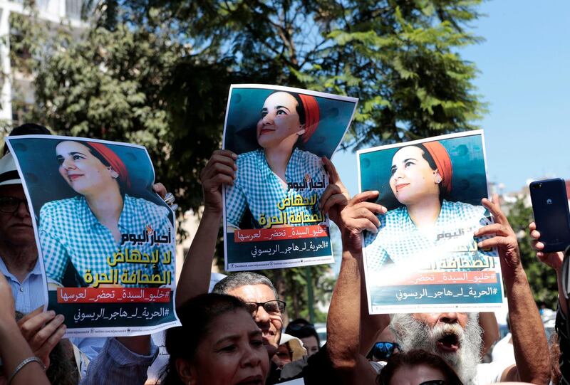 FILE PHOTO: Moroccan activists hold posters of Hajar Raissouni, a journalist charged with having sex before marriage and having an illegalabortion, during a protest outside the Rabat tribunal, Morocco, September 9, 2019. REUTERS/Youssef Boudlal/File Photo