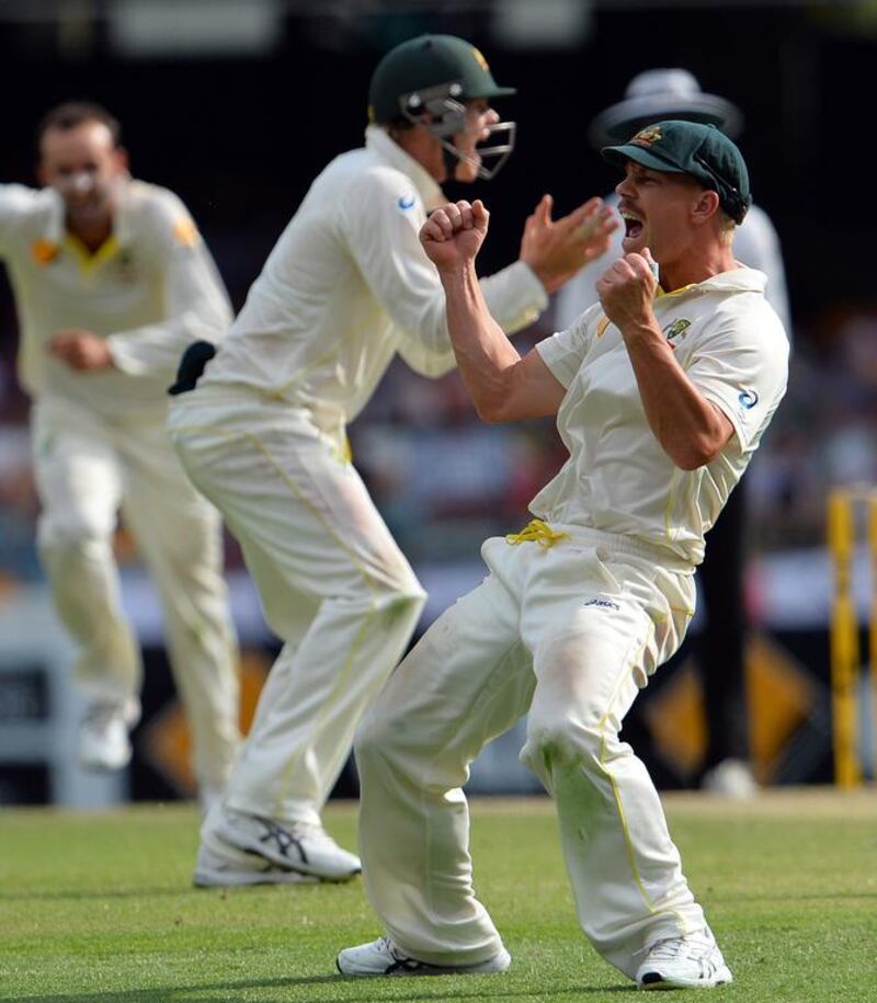 Australia's David Warner, right, celebrates the dismissal of England's Matt Prior during Day 4 of the first Ashes Test in Brisbane on Sunday. The old rivals dominated the spotlight in a way India and Pakistan used to during the 1980s. Saeed Khan / AFP