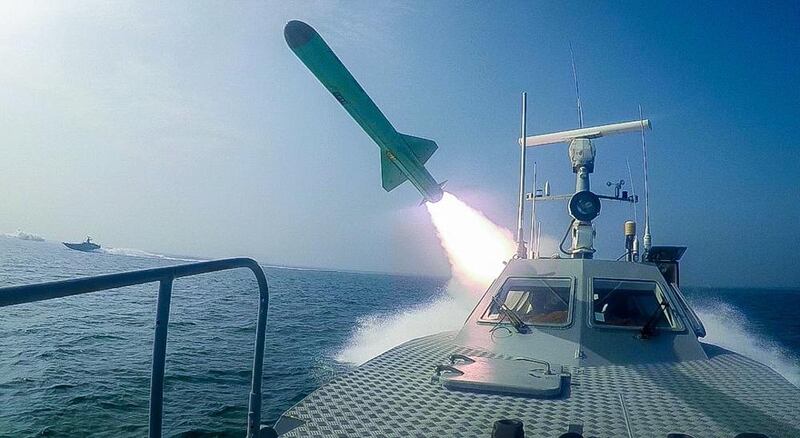 Iran fires a missile targeting a mock-up of US aircraft carrier in the Strait of Hormuz.  EPA