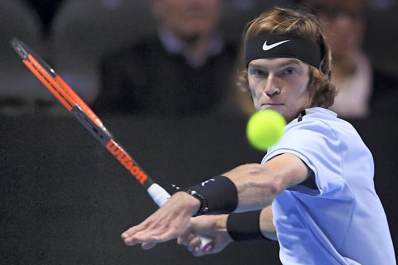 Andrey Rublev from Russia returns the ball to Hyeon Chung from South Korea in their men's singles tennis final match during the first edition of the Next Generation ATP Finals in Milan on November 11, 2017, an annual men's youth tennis tournament organized by the Italian Tennis Federation and the Italian Olympic Committee.   / AFP PHOTO / MARCO BERTORELLO