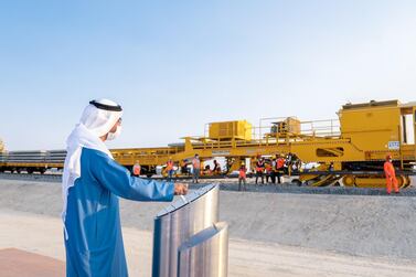 Sheikh Hamdan bin Zayed, the Ruler’s Representative in Al Dhafra, inaugurates the track laying in Ruwais for the expanding Etihad Rail network. 