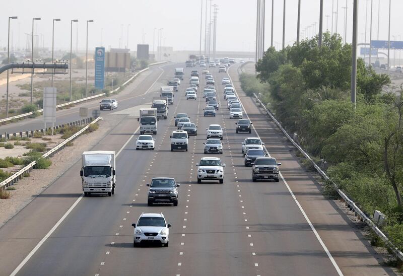 Abu Dhabi, United Arab Emirates - August 12, 2018: Morning commuters head from Dubai towards Abu Dhabi on the first day of no speed buffer. Sunday, August 12th, 2018 on E11, Abu Dhabi. Chris Whiteoak / The National
