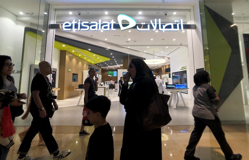 Shoppers walk in front of Etisalat Telecommunication in Dubai Mall, in Dubai, United Arab Emirates, December 20, 2018. Picture taken December 20, 2018. REUTERS/Hamad I Mohammed