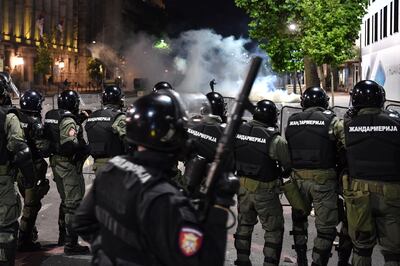 Police block a road during clashes with   protesters near the   National Assembly building in Belgrade, on July 10, 2020, at a demonstration against a weekend curfew announced to combat a resurgence of COVID-19 (novel coronavirus) infections. Serbia announced a record coronavirus death toll for a single day on July 10, as the government hit back at protests over its handling of the pandemic. / AFP / ANDREJ ISAKOVIC
