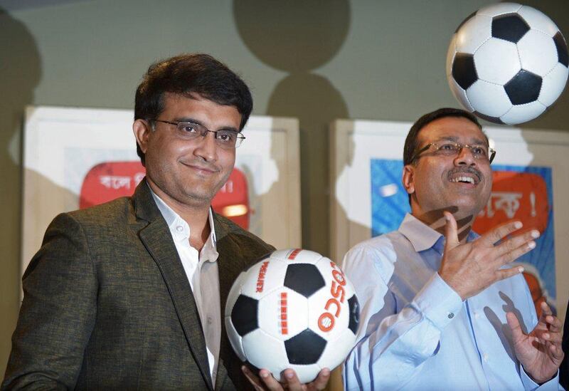 Sourav Ganguly, left, and Sanjiv Goenka, vice-chairman of RPG Enterprises, pose with footballs during a press conference to announce their ownership of the Kolkata franchise in the upcoming Indian Super League on April 14, 2014. Dibyangshu Sarkar / AFP