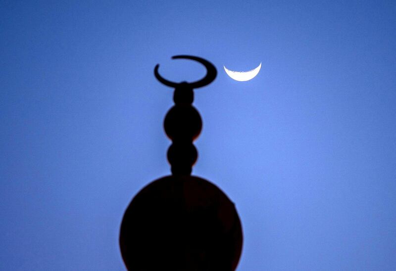 Abu Dhabi, United Arab Emirates, April 17, 2021.   The crescent moon shows itself at the Sheikh Zayed Bin Sultan Al Nahyan Mosque at Al Bahia, Abu Dhabi.
Victor Besa/The National
Section:  NA/Stand Alone/Stock Images