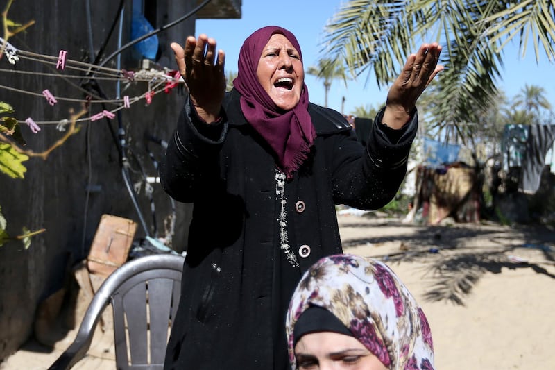 A female relative of three Palestinian fishermen from Allaham family mourn during their funeral in Khan Younis in the southern Gaza Strip. Reuters