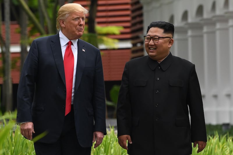 (FILES) In this file photo taken on June 11, 2018 North Korea's leader Kim Jong Un (R) walks with US President Donald Trump (L) during a break in talks at their historic US-North Korea summit, at the Capella Hotel on Sentosa island in Singapore. President Donald Trump on September 19, 2018 said US relations with North Korea are making "tremendous progress" from the days before his presidency when the two countries appeared close to "going to war." Trump said a recent letter from North Korean leader Kim Jong Un confirmed the positive track, which he said has seen the hardline communist country promise to halt its nuclear missile test program and mount a combined bid with South Korea for the 2032 Olympic Games.
 / AFP / SAUL LOEB
