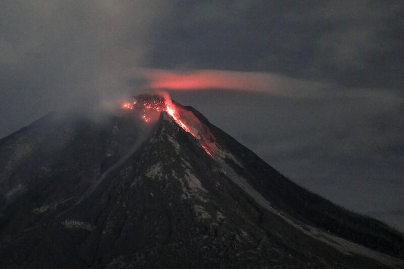 A long exposure image shows molten lava spilling from Mount Sinabung as it is seen from Karo, North Sumatra, Indonesia.Mount Sinabung is one of the most active volcanoes in Indonesia. It erupted in 2010 and since then killed 16 people in eruptions in 2014 and another nine people in 2016.  Dedi Sinuhaji / EPA