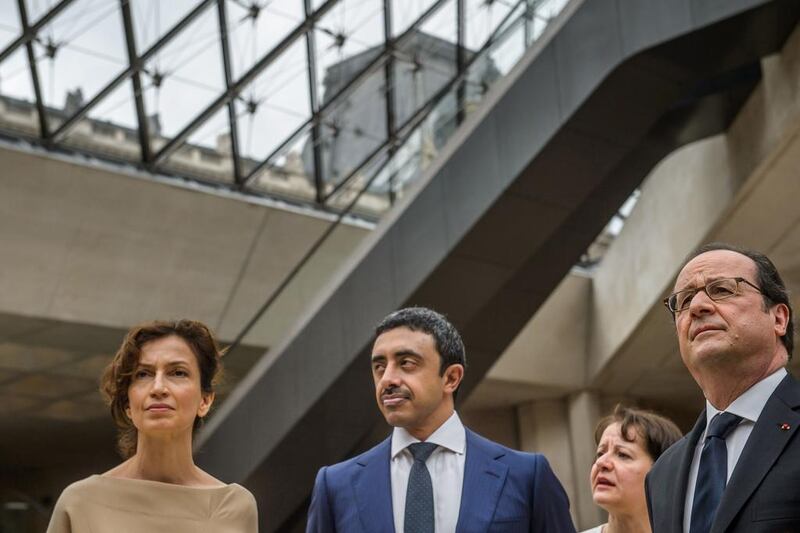 From left: French culture minister Audrey Azoulay, Sheikh Abdullah bin Zayed and French president Francois Hollande visit the Louvre museum. Christophe Petit Tesson / AFP
