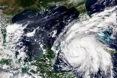 This Sept.  26, 2022, satellite image released by NASA shows Hurricane Ian growing stronger as it barreled toward Cuba.  Ian was forecast to hit the western tip of Cuba as a major hurricane and then become an even stronger Category 4 with top winds of 140 mph (225 km/h) over warm Gulf of Mexico waters before striking Florida.  (NASA Worldview / Earth Observing System Data and Information System (EOSDIS) via AP)