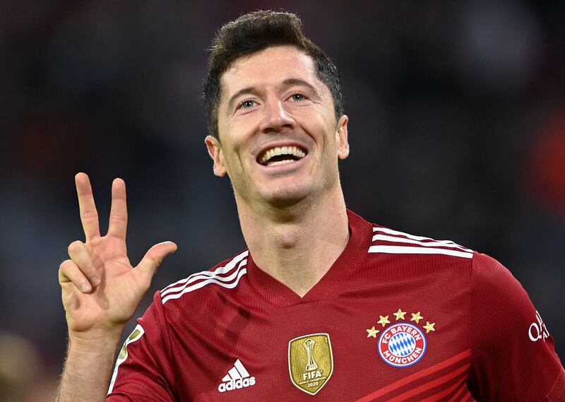 Bayern Munich's Polish forward Robert Lewandowski celebrates scoring the 5-0 and his hattrick during the German first division Bundesliga football match between FC Bayern Munich and Hertha BSC Berlin in Munich, southern Germany, on August 28, 2021.  (Photo by CHRISTOF STACHE  /  AFP)  /  DFL REGULATIONS PROHIBIT ANY USE OF PHOTOGRAPHS AS IMAGE SEQUENCES AND / OR QUASI-VIDEO