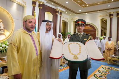 ABU DHABI, UNITED ARAB EMIRATES - May 04, 2015:  HH Sheikh Mohamed bin Zayed Al Nahyan Crown Prince of Abu Dhabi and Deputy Supreme Commander of the UAE Armed Forces (2nd L) presents the Zayed Medal to HM King Mohammed VI of Morocco (L) during a reception held at Mushrif Palace. 


( Mohamed Al Hammadi / Crown Prince Court - Abu Dhabi )
--- *** Local Caption ***  NA06ma-pg2_MAIN.JPG
