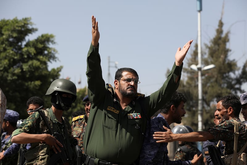 A police officer hails the executions. Reuters