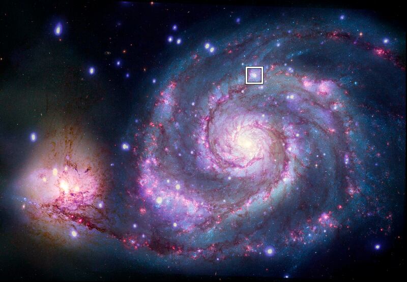 A composite image of M51 with X-rays from Chandra and optical light from Nasa's Hubble Space Telescope contains a box that marks the location of a possible planet. Photo: Nasa