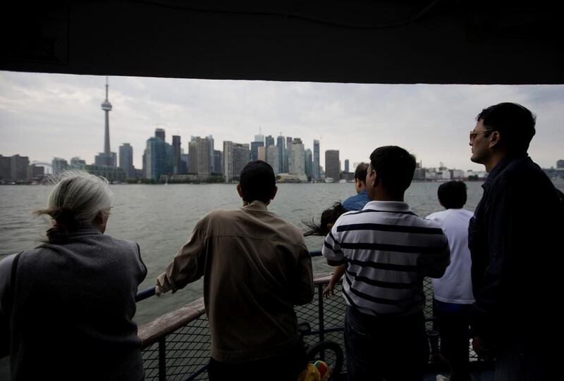 Tourists on the Centre Island ferry in Toronto, Canada. The city’s tourism authority says it has invested greatly to make visitors from the Middle East more comfortable in travelling there. Brent Lewin /Bloomberg News