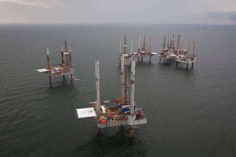 FILE PHOTO: Unused oil rigs sit in the Gulf of Mexico near Port Fourchon, Louisiana, U.S., August 11, 2010.  REUTERS/Lee Celano/File Photo