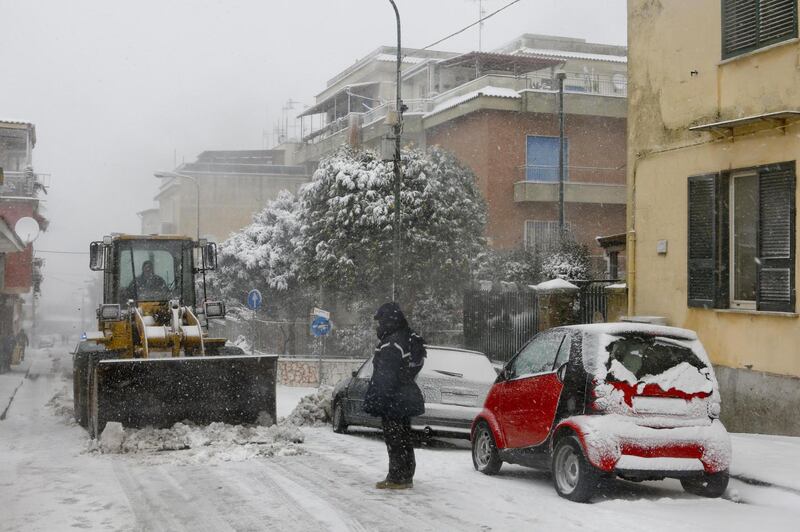 Snow is cleared from a street in the Camaldoli's Hill, over Naples, southern Italy. EPA