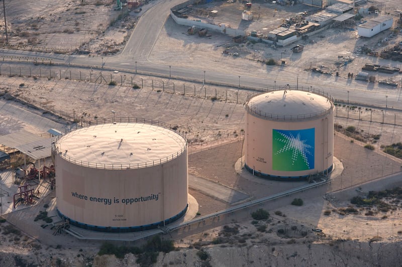 Aramco storage tanks in Saudi Arabia. The company will pay a third-quarter dividend of $18.8 billion in the fourth quarter of the year. AFP