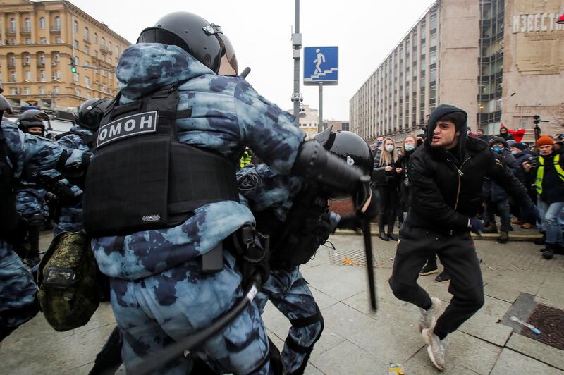 Law enforcement officers clash with protesters during a rally in support of jailed Russian opposition leader Alexei Navalny in Moscow. Reuters