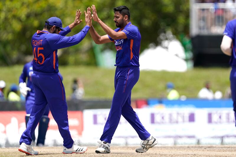 India's Rohit Sharma, left, celebrates with Avesh Khan after the dismissal of Brandon King. AP