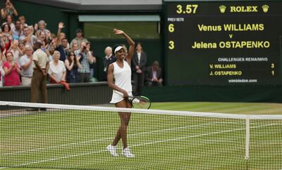 Venus Williams of the United States celebrates after beating Latvia's Jelena Ostapenko at the end of their Women's Quarterfinal Singles Match on day eight at the Wimbledon Tennis Championships in London, Tuesday, July 11, 2017. (AP Photo/Tim Ireland)