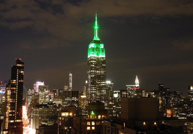 The Empire State Building is lit in green in New York City to celebrate the Eid Al Fitr holiday that marks the end of Ramadan. The Empire State Building famously shines specific colors for a number of religious holidays – pastel shades for Easter, blue and white for Hanukkah, and red and green for Christmas. Brigitte Dusseau / AFP photo
