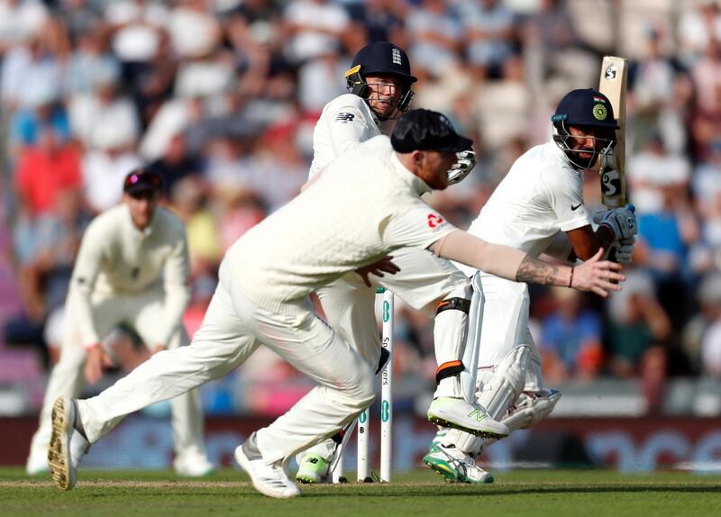 Cricket - England v India - Fourth Test - Ageas Bowl, West End, Britain - August 31, 2018   India's Cheteshwar Pujara hits a shot past England's Jos Buttler and Ben Stokes   Action Images via Reuters/Paul Childs