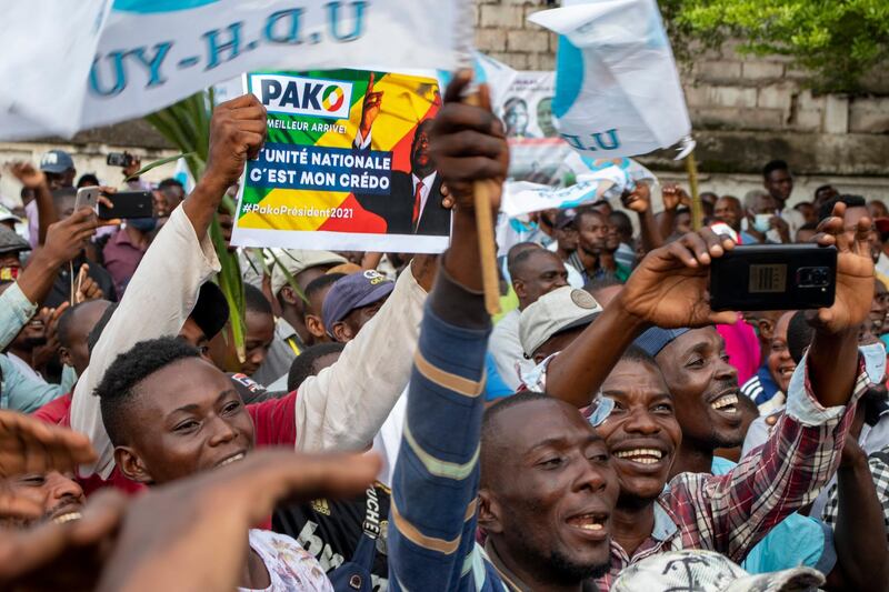 Supporters of opposition presidential candidate Guy Brice Parfait Kolelas cheer during their party's last rally of the presidential campaign in Brazzaville, Congo, Friday March 19, 2021. After 36 years in power, Republic of Congo's President Denis Sassou Nâ€™Guesso appears poised to extend his tenure as one of Africa's longest-serving leaders in the elections to be held Sunday amid opposition complaints of interference with their campaigns. (AP Photo/Christ Kimvidi)