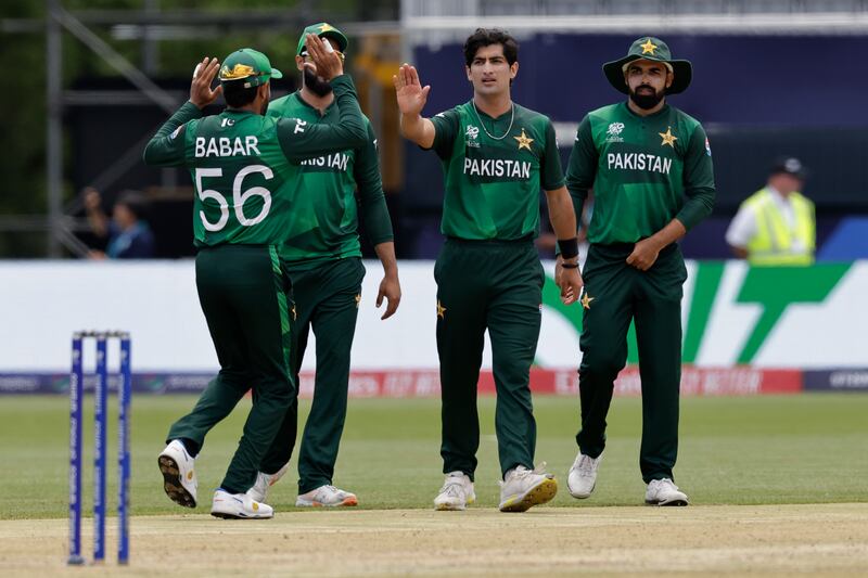 Pakistan's Naseem Shah, second right, celebrates with teammates after the dismissal of Canada opener Aaron Johnson. AP