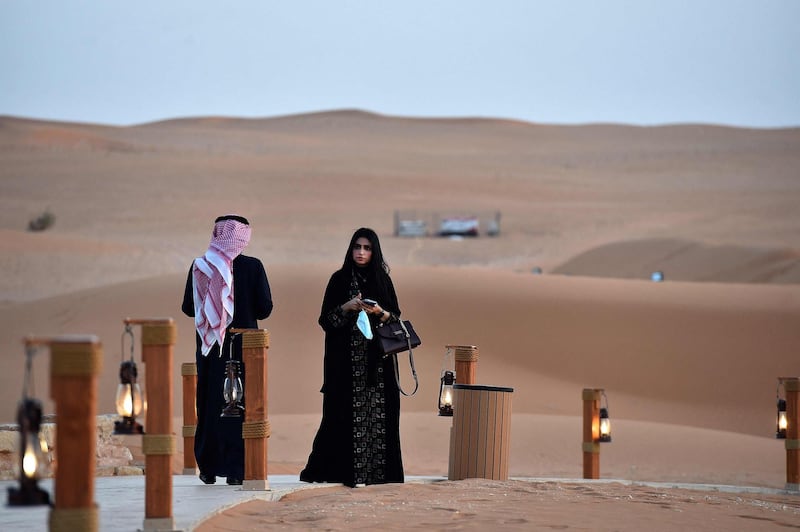 Visitors take in the views from a walkway at the "Riyadh Oasis," a luxury retreat in the Thumamah desert on the outskirts of the Saudi capital Riyadh. . AFP