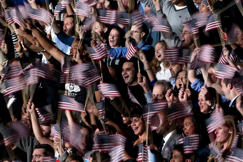 CHICAGO, IL - NOVEMBER 06: Supporters of U.S. President Barack Obama cheer as they wait for Obama to appear on stage for his victory speech at McCormick Place November 6, 2012 in Chicago, Illinois. Obama won reelection against Republican candidate, former Massachusetts Governor Mitt Romney.   Spencer Platt/Getty Images/AFP== FOR NEWSPAPERS, INTERNET, TELCOS & TELEVISION USE ONLY ==
 *** Local Caption ***  837777-01-09.jpg