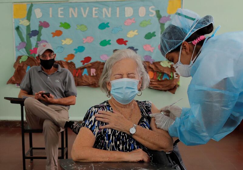 A woman receives the second dose of the Pfizer vaccine at the Belisario Porras School, in Panama City, Panama. The president of Panama, Laurentino Cortizo, announced that another batch of Pfizer vaccines will arrive, assuring that the country has enough doses. EPA