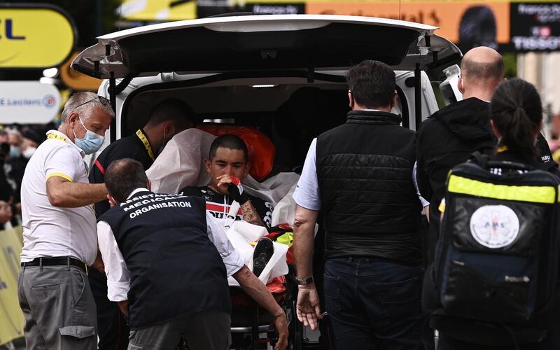 Australian rider Caleb Ewan of the Lotto Soudal team is taken to an ambulance after he crashed shortly before the finish line of the third stage of the Tour de France. EPA