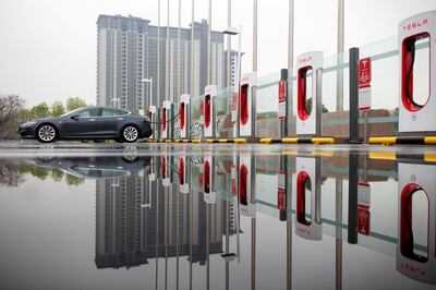 A Tesla car at a charging point in Beijing. Reuters