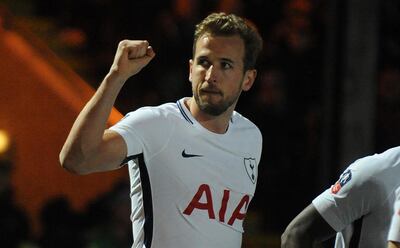 Tottenham's Harry Kane celebrates after scoring during the English FA Cup fifth round soccer match between Rochdale AFC and Tottenham Hotspur at the Crown Oil Arena in Rochdale, England, Sunday, Feb. 18, 2018. (AP Photo/Rui Vieira)