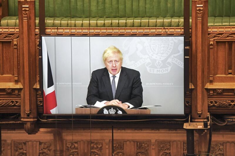 A handout photograph released by the UK Parliament shows Britain's Prime Minister Boris Johnson attending the House of Commons remotely by video-link to update MPs on the COVID-19 pandemic, in a hybrid, socially distanced session at the House of Commons in London on November 23, 2020. - Britain's Prime Minister Boris Johnson on Monday expressed optimism for an end to coronavirus restrictions as he announced the lifting of measures in England from early next month. Johnson was forced into self-isolation after meeting with one of his MPs who consequently tested positive for coronavirus. (Photo by JESSICA TAYLOR / UK PARLIAMENT / AFP) / RESTRICTED TO EDITORIAL USE - NO USE FOR ENTERTAINMENT, SATIRICAL, ADVERTISING PURPOSES - MANDATORY CREDIT " AFP PHOTO / Jessica Taylor /UK Parliament"