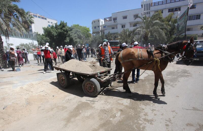 A horse and cart are used in the Gaza clean-up after the 11-day bombardment.