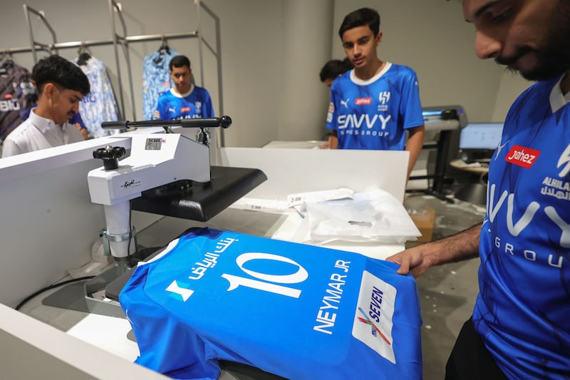 Al Hilal jerseys bearing the name and number of their latest star signing - Brazilian forward Neymar. AFP