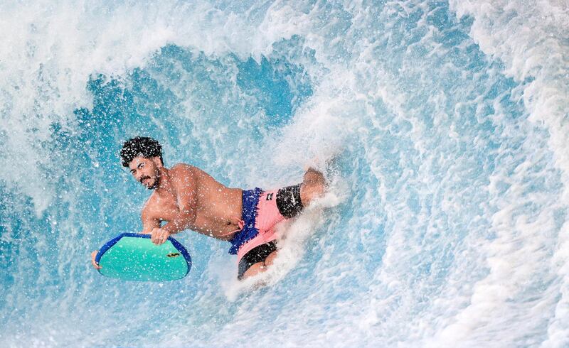 Abu Dhabi, United Arab Emirates, August 4, 2020.   Yas Waterworld Abu Dhabi opens with 30% capacity as Covid-19 restrictions slowly come to an ease.  A body boarder flips the waves at the waterpark.
Victor Besa /The National
Section: NA
Reporter: