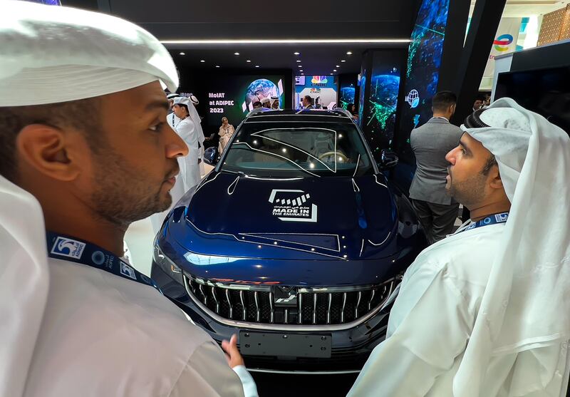 Visitors admire the Rabdan One, a fully electric vehicle made in the UAE, which is on display at the Ministry of Industry and Advanced Technology stall, Adipec 2023