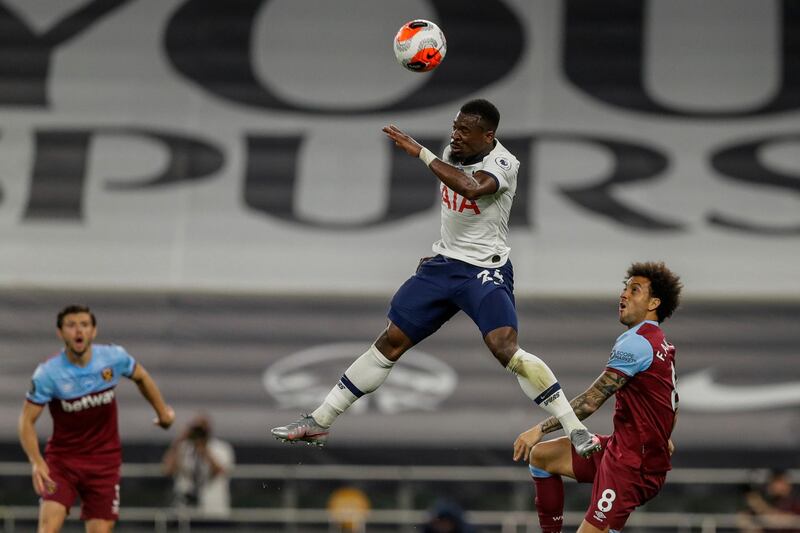 Tottenham's Serge Aurier jumps for the ball in front West Ham's Felipe Anderson. AP