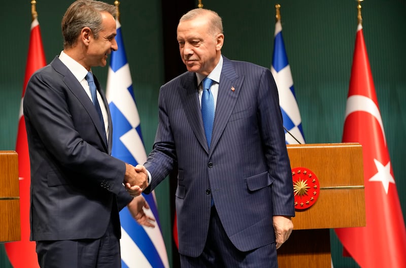 Greek Prime Minister Kyriakos Mitsotakis and Turkish President Recep Tayyip Erdogan shake hands after a joint news conference in Ankara, Turkey. AP
